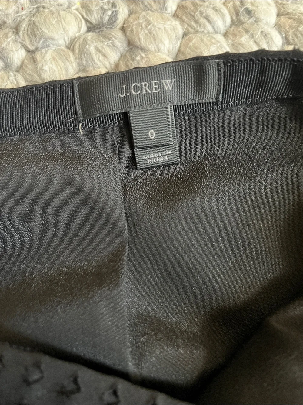 J. Crew black laser cut pleated A-line skirt.